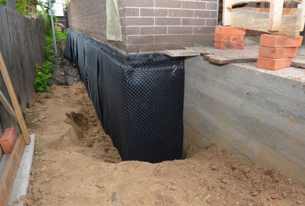 SJ Waterproofing Pros technician performing targeted Waterproofing assessment in Clinton, KY